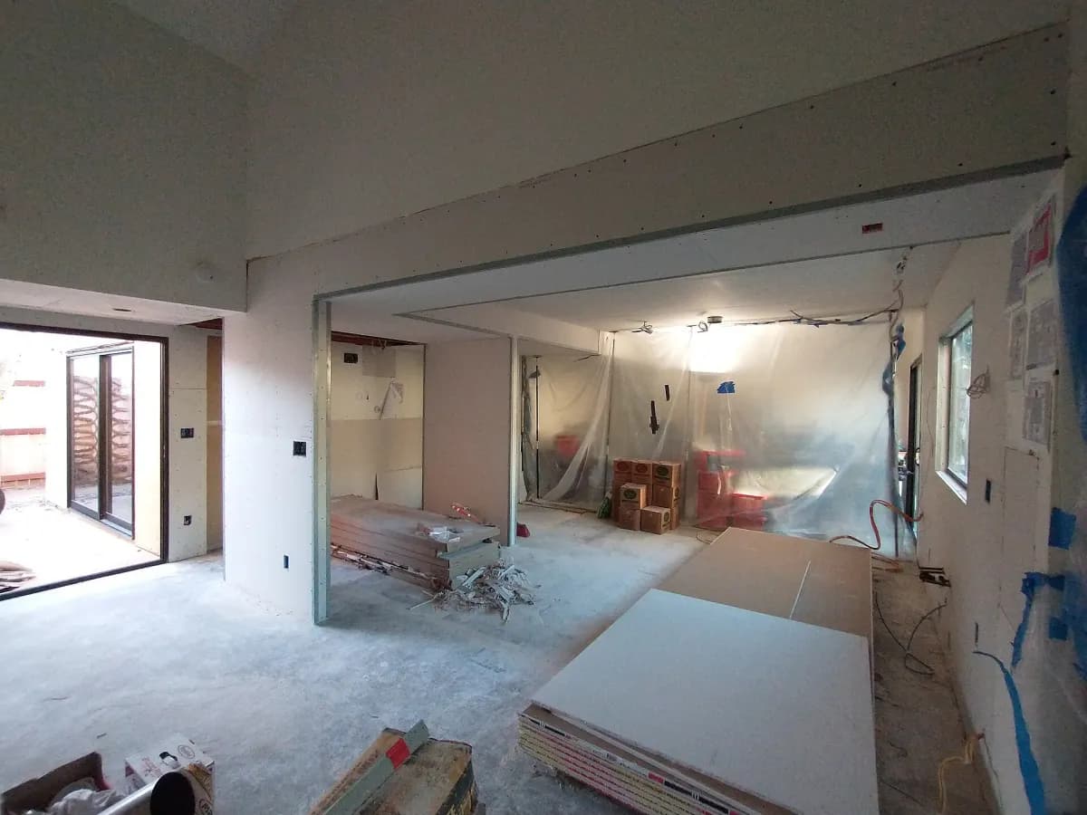 The same room eight days later, walls and ceiling boarded